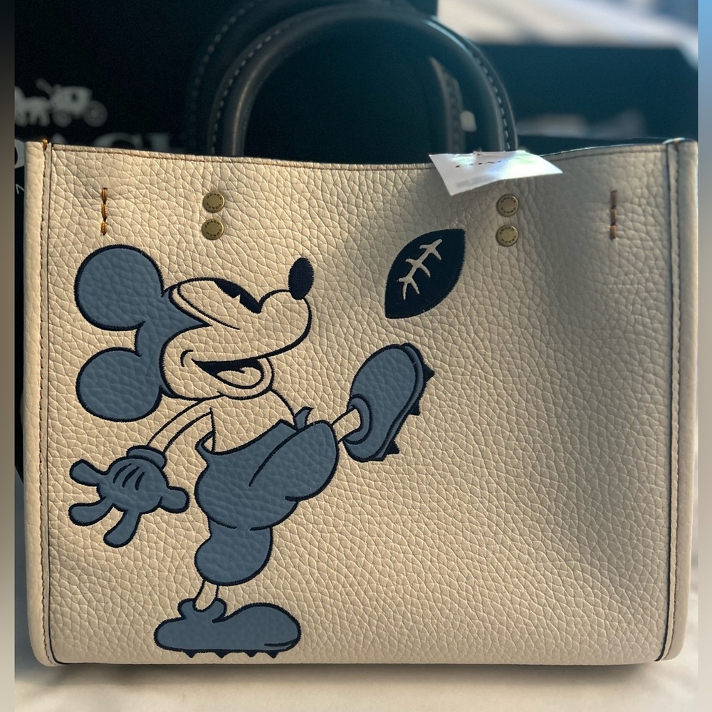 NWT COACH DISNEY ROGUE 25 PEBBLE LEATHER BAG WITH CROSSBODY STRAP.